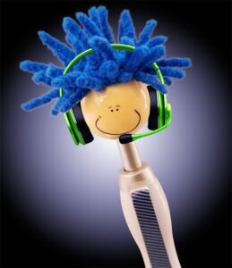 ink pen with smiling plastic head on the end with blue yarn hair and green headset